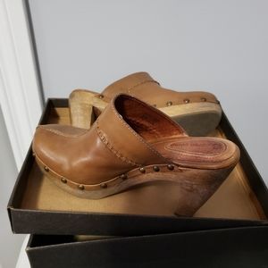 High Stepping Clogs.